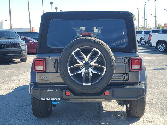 used 2024 Jeep Wrangler 4xe car, priced at $27,161