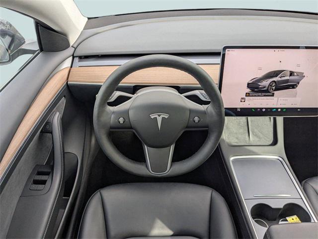 used 2023 Tesla Model 3 car, priced at $27,345