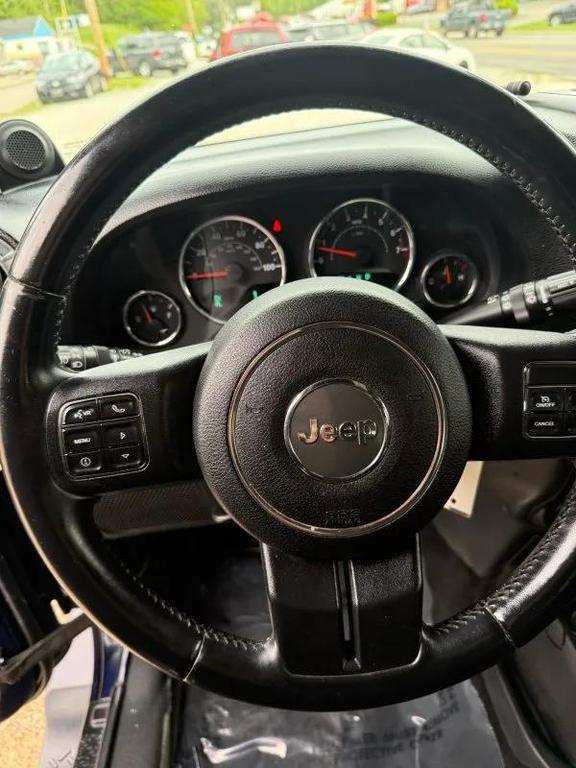 used 2013 Jeep Wrangler Unlimited car, priced at $13,995