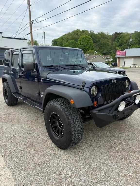 used 2013 Jeep Wrangler Unlimited car, priced at $13,995