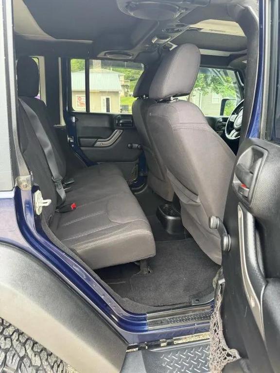 used 2013 Jeep Wrangler Unlimited car, priced at $13,995