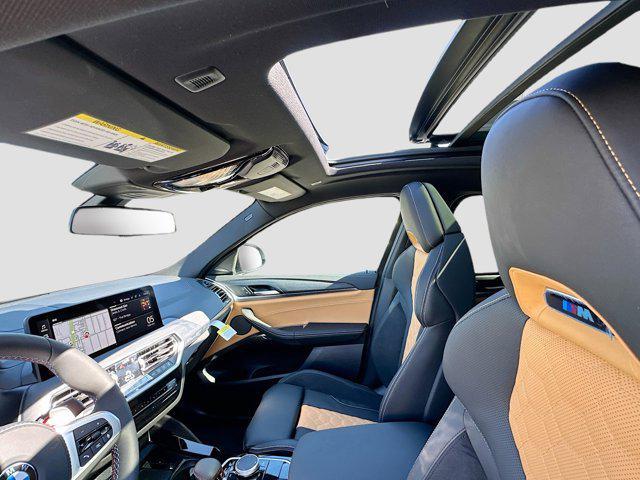 used 2025 BMW X4 M car, priced at $79,596