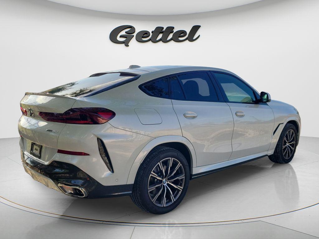 used 2025 BMW X6 car, priced at $69,597