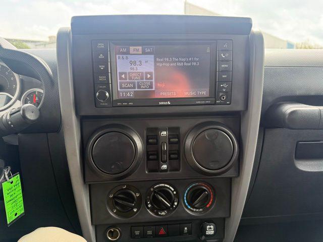 used 2010 Jeep Wrangler Unlimited car, priced at $13,676