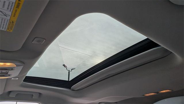 used 2025 Toyota Highlander Hybrid car, priced at $54,500