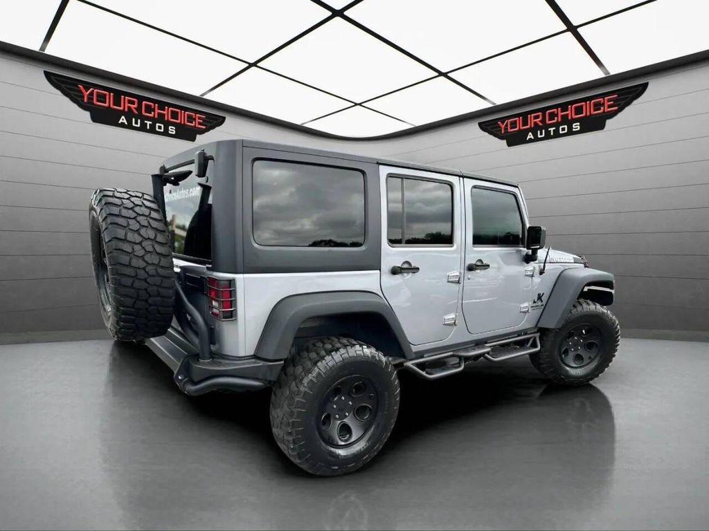 used 2015 Jeep Wrangler Unlimited car, priced at $23,977