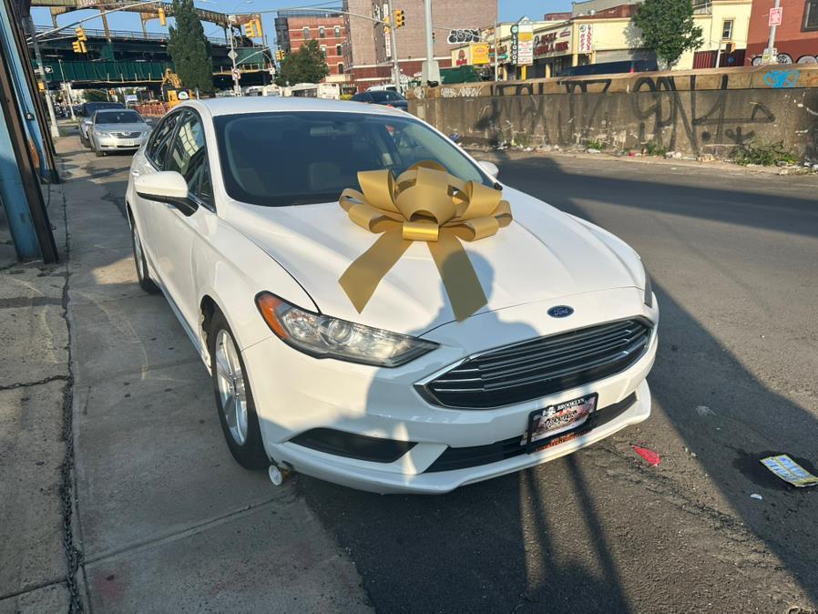 used 2018 Ford Fusion car, priced at $9,999