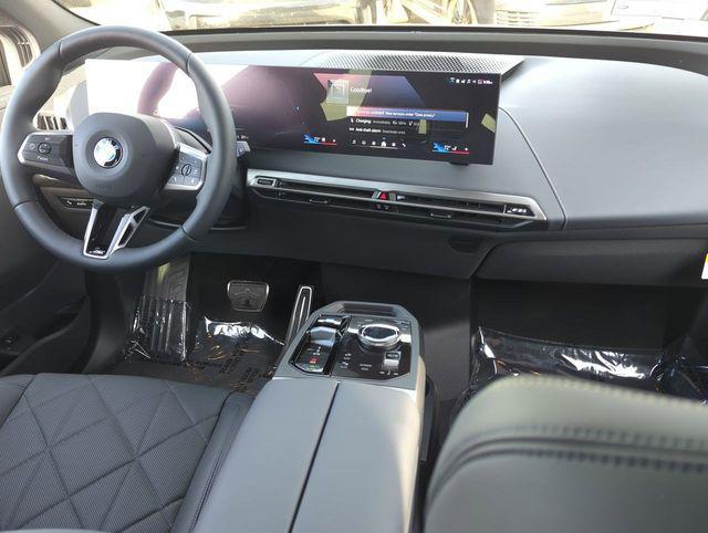 new 2026 BMW iX car, priced at $102,545