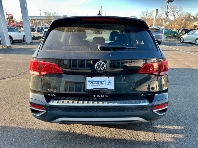 used 2023 Volkswagen Taos car, priced at $19,065