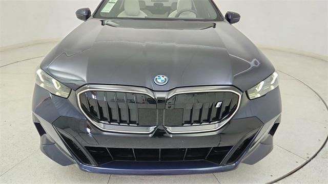 used 2025 BMW i5 car, priced at $57,950