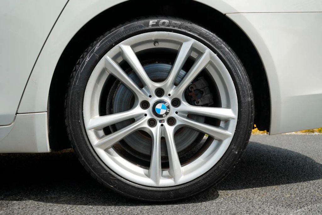 used 2015 BMW 750 car, priced at $12,999