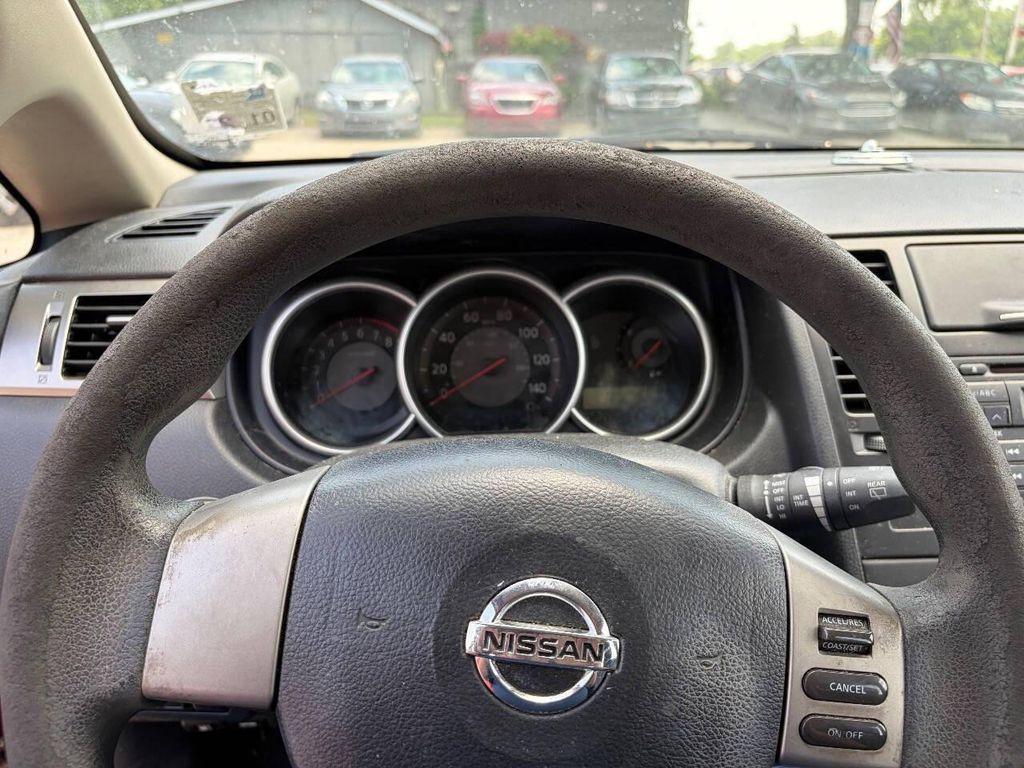 used 2009 Nissan Versa car, priced at $4,950