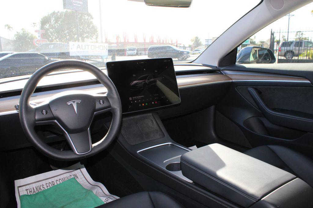 used 2023 Tesla Model 3 car, priced at $17,000