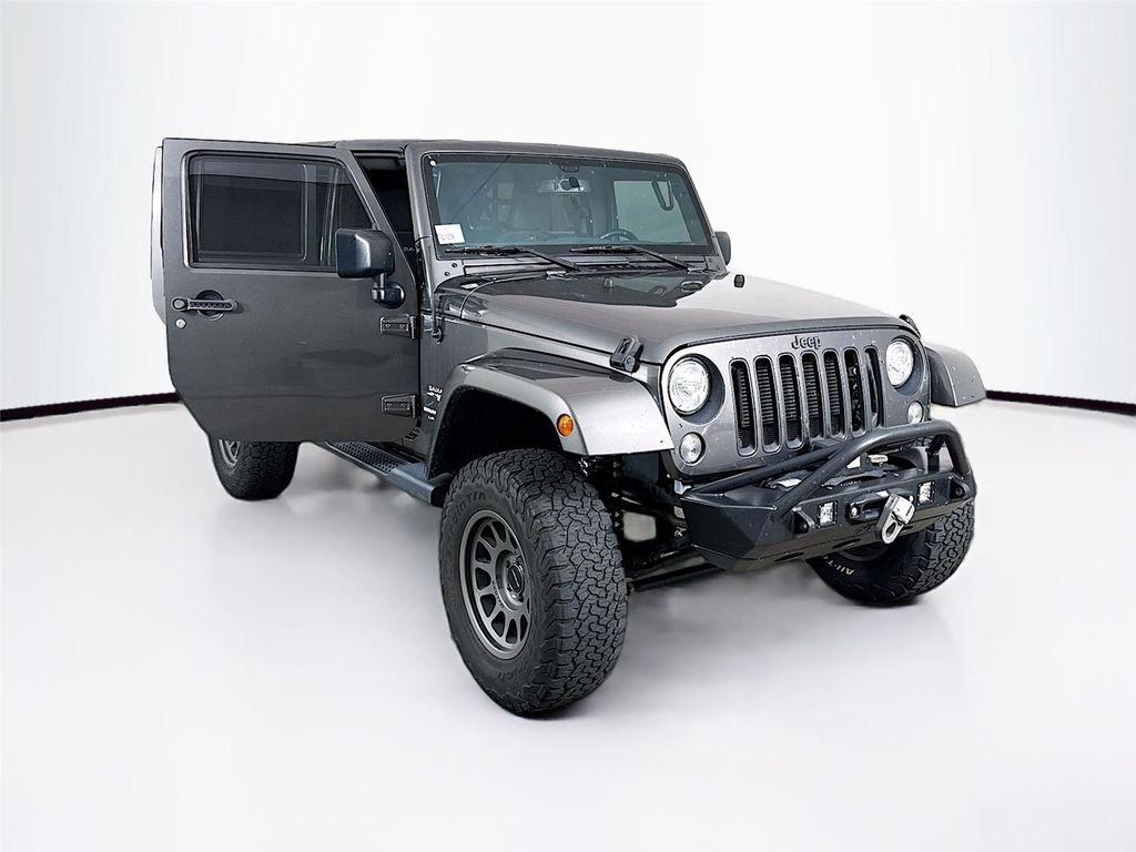 used 2018 Jeep Wrangler JK Unlimited car, priced at $19,375