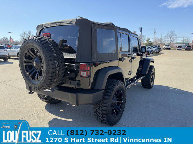 used 2010 Jeep Wrangler Unlimited car, priced at $12,879