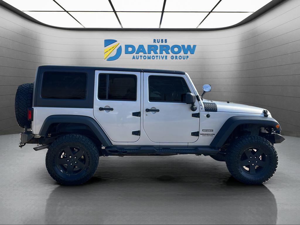 used 2012 Jeep Wrangler Unlimited car, priced at $13,899
