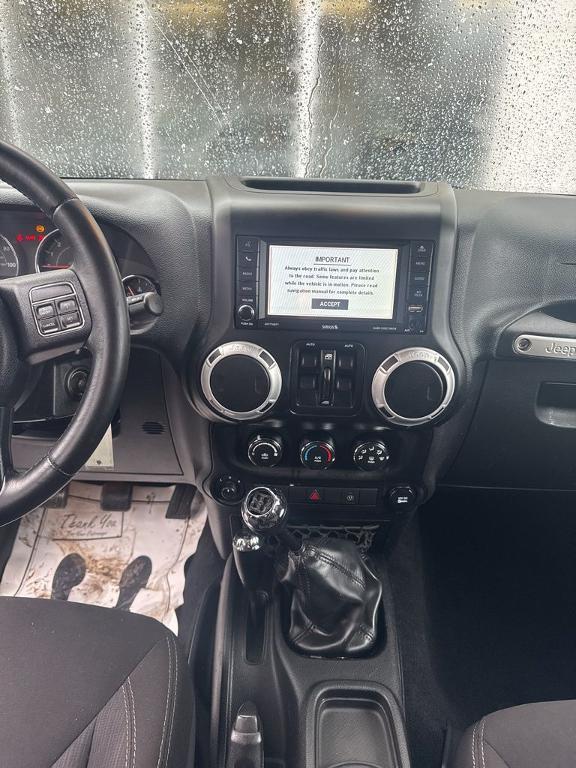 used 2014 Jeep Wrangler Unlimited car, priced at $16,801