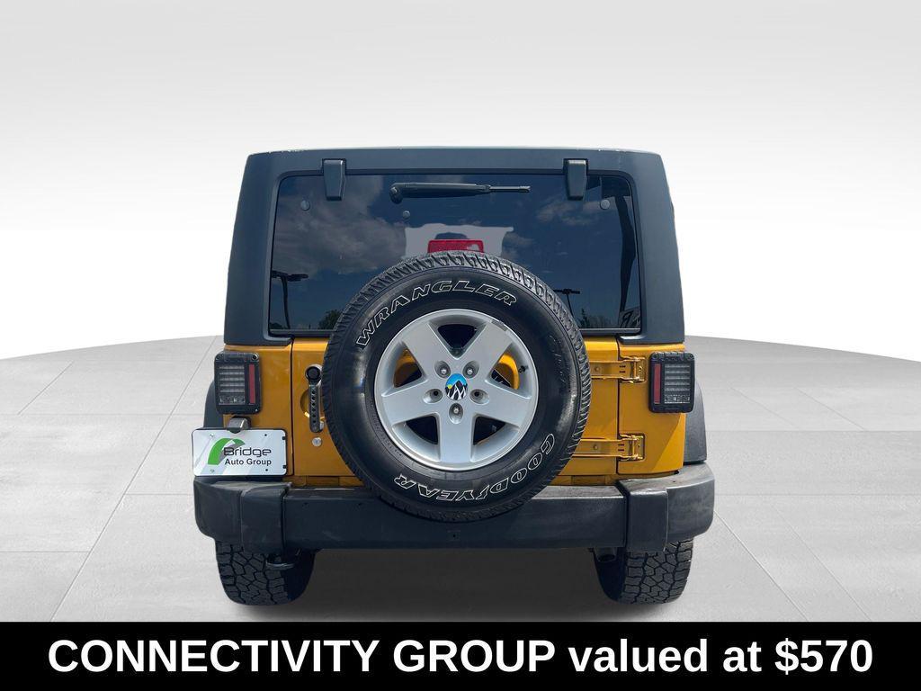 used 2014 Jeep Wrangler Unlimited car, priced at $13,576