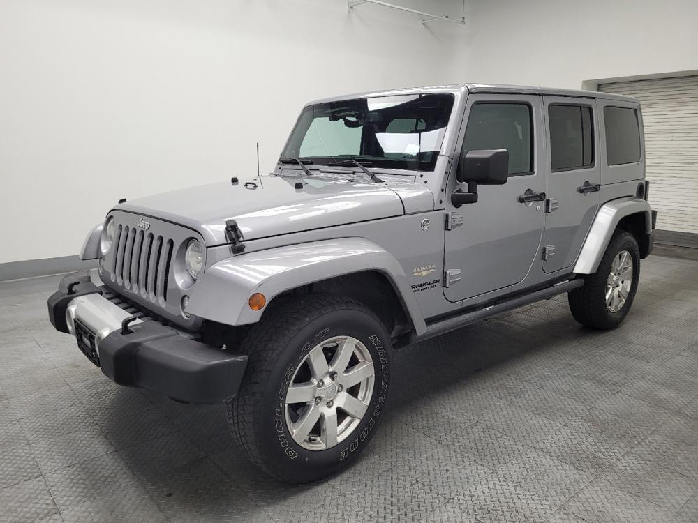 used 2014 Jeep Wrangler Unlimited car, priced at $19,195
