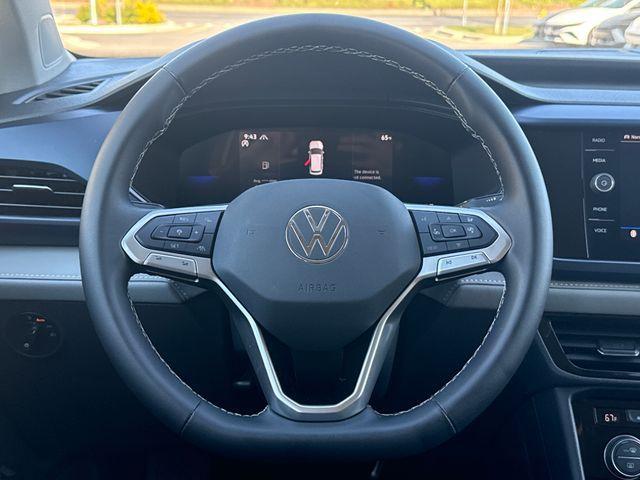 used 2024 Volkswagen Taos car, priced at $22,999