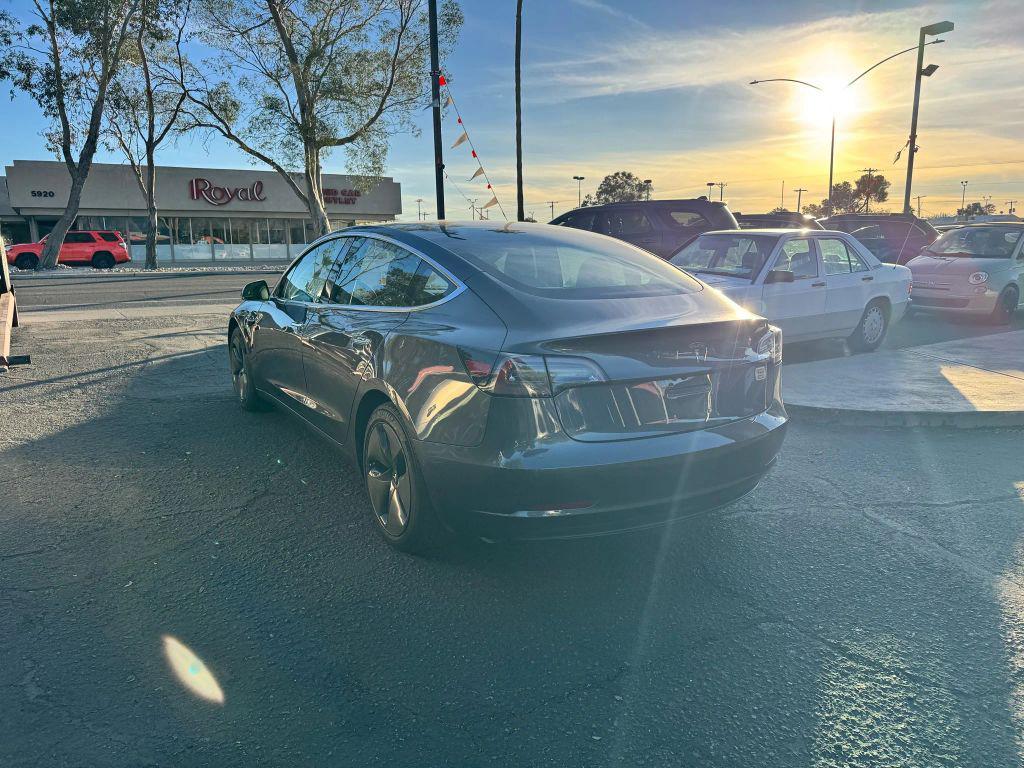 used 2018 Tesla Model 3 car, priced at $15,000