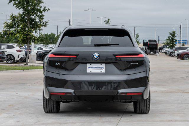 used 2024 BMW iX car, priced at $59,899