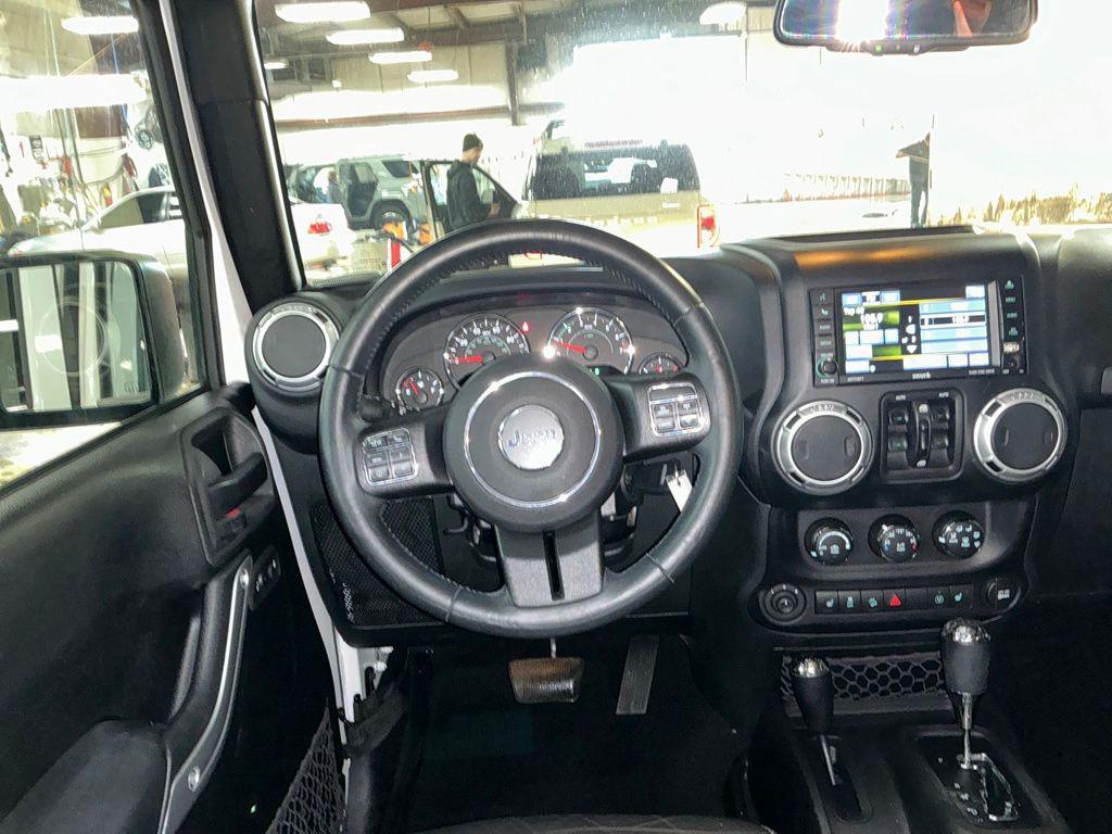 used 2015 Jeep Wrangler Unlimited car, priced at $13,911