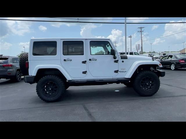 used 2013 Jeep Wrangler Unlimited car, priced at $18,595