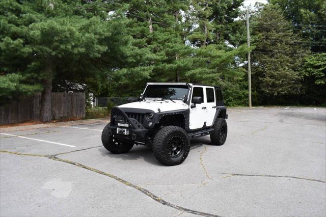 used 2014 Jeep Wrangler Unlimited car, priced at $19,990