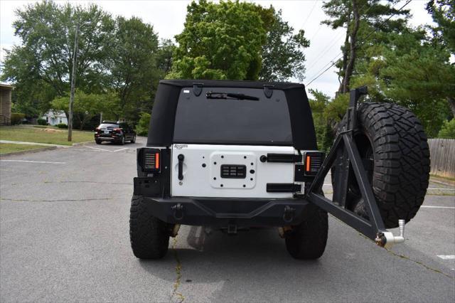 used 2014 Jeep Wrangler Unlimited car, priced at $19,990