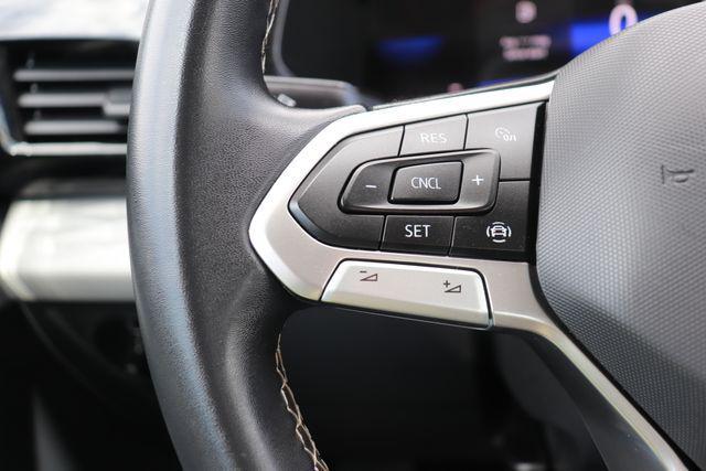 used 2023 Volkswagen Taos car, priced at $17,500