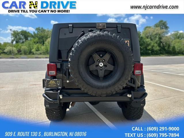 used 2014 Jeep Wrangler Unlimited car, priced at $17,544