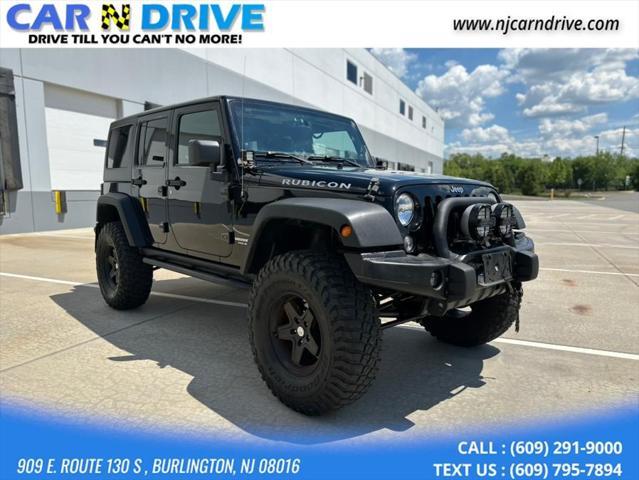 used 2014 Jeep Wrangler Unlimited car, priced at $17,544