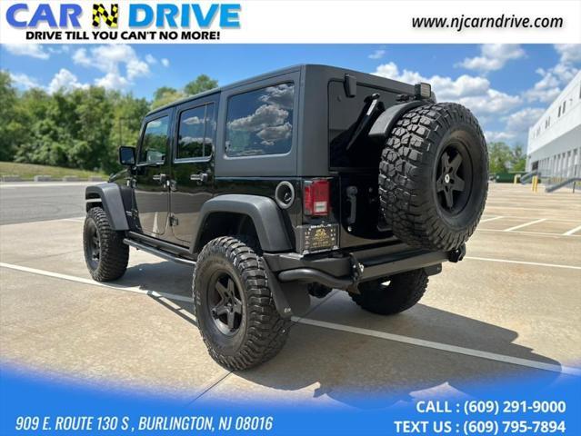 used 2014 Jeep Wrangler Unlimited car, priced at $17,544