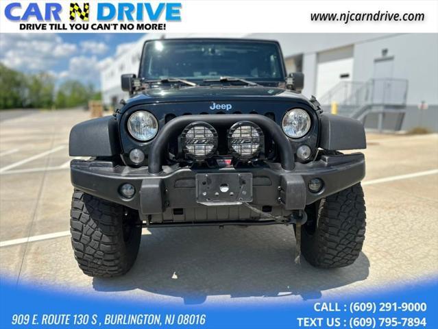 used 2014 Jeep Wrangler Unlimited car, priced at $17,544