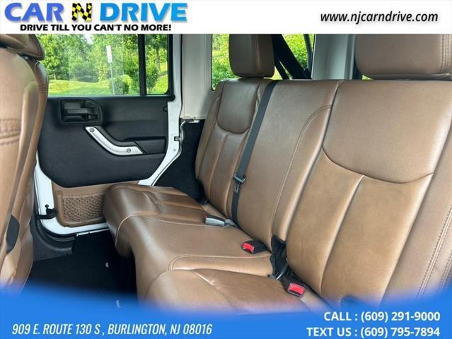 used 2013 Jeep Wrangler Unlimited car, priced at $15,899