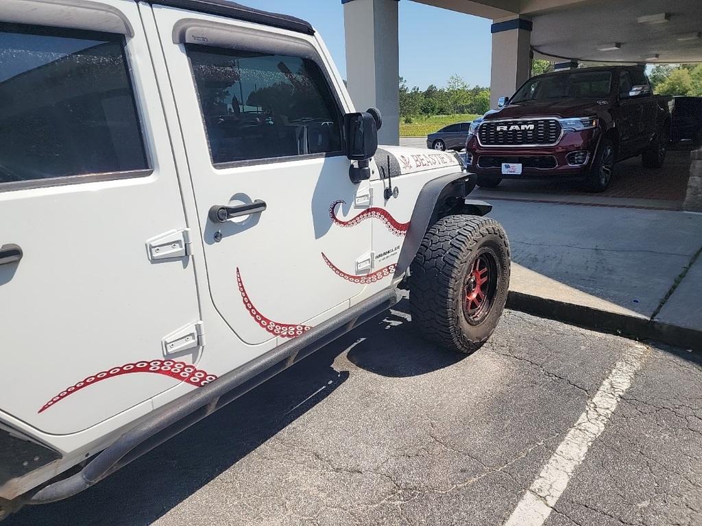 used 2016 Jeep Wrangler Unlimited car, priced at $22,368