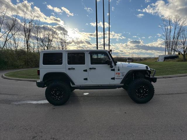 used 2013 Jeep Wrangler Unlimited car, priced at $13,995