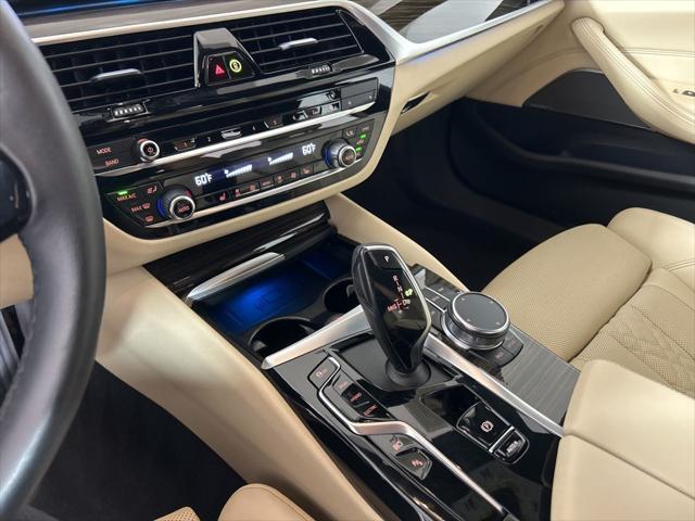 used 2023 BMW 530e car, priced at $39,562