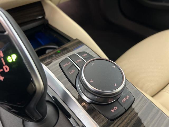 used 2023 BMW 530e car, priced at $39,562