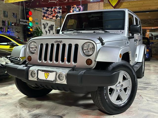 used 2011 Jeep Wrangler Unlimited car, priced at $13,985