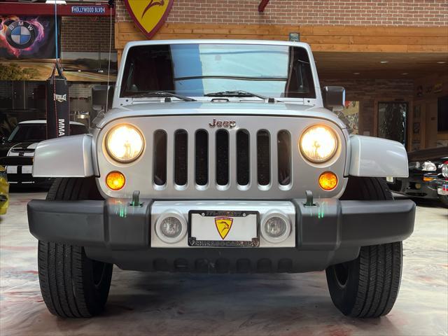 used 2011 Jeep Wrangler Unlimited car, priced at $13,985