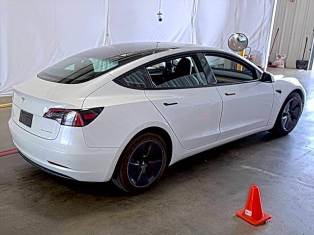 used 2023 Tesla Model 3 car, priced at $20,300