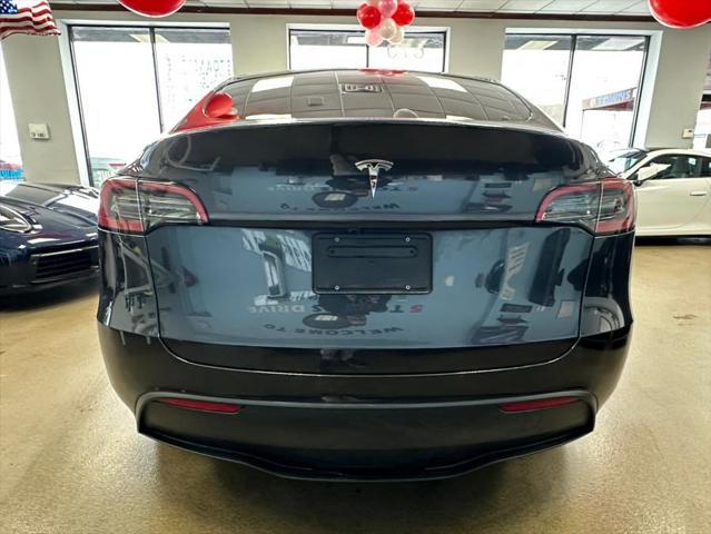 used 2024 Tesla Model Y car, priced at $32,995