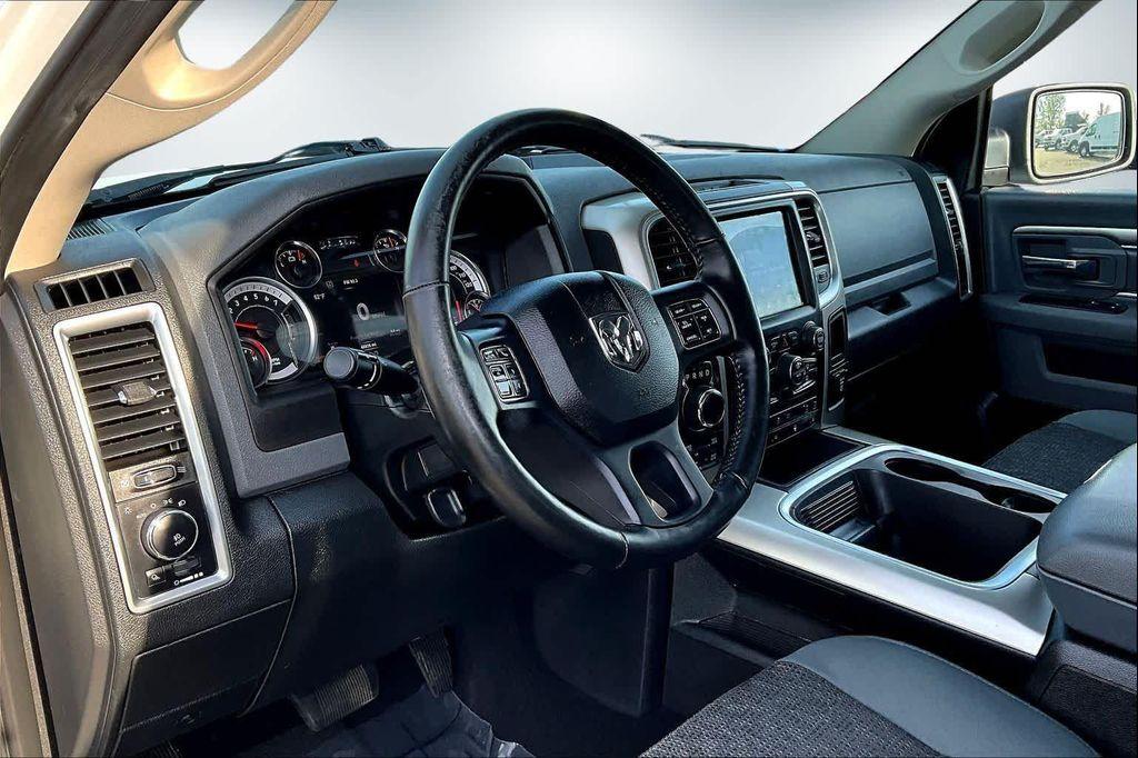 used 2018 Ram 1500 car, priced at $26,488