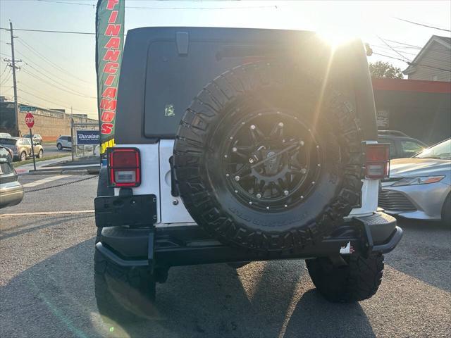 used 2013 Jeep Wrangler Unlimited car, priced at $17,999