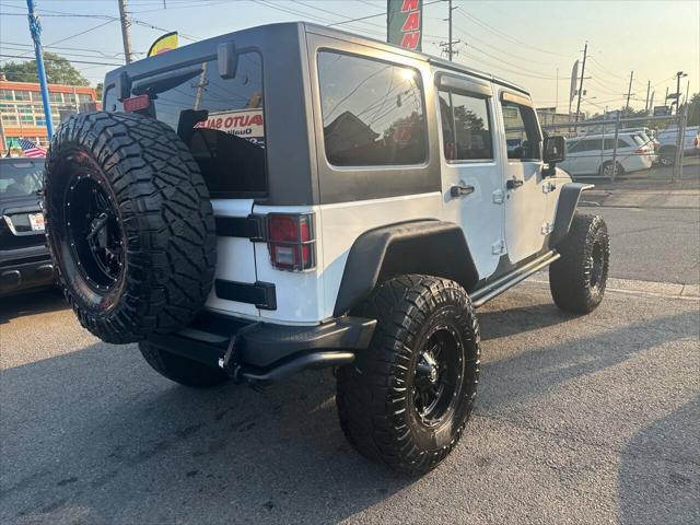 used 2013 Jeep Wrangler Unlimited car, priced at $17,999