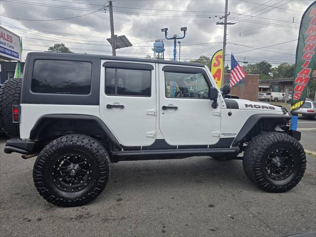 used 2013 Jeep Wrangler Unlimited car, priced at $17,999