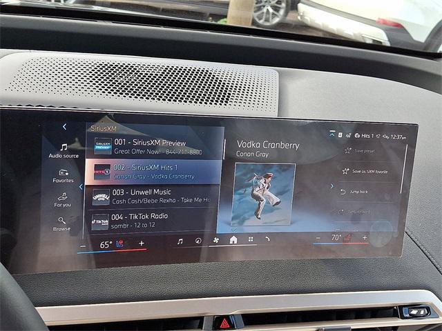 new 2026 BMW iX car, priced at $97,320