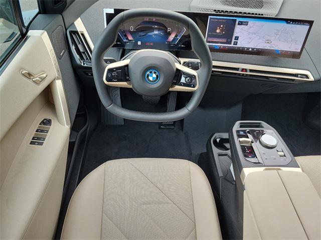 new 2024 BMW iX car, priced at $95,595